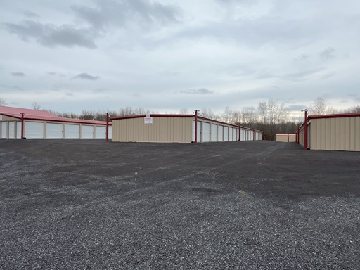 Storage buildings and wide asphalt drive at Ryder Storage